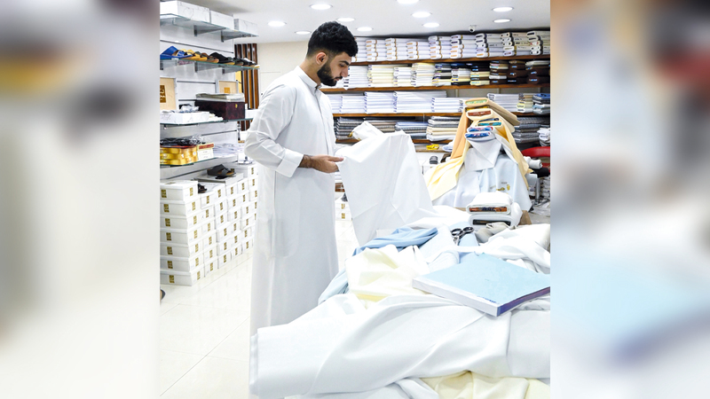 Residents seen shopping at a Kandora tailor shop for Eid in Sharjah. April 18  2023. Photo by Ashok Verma